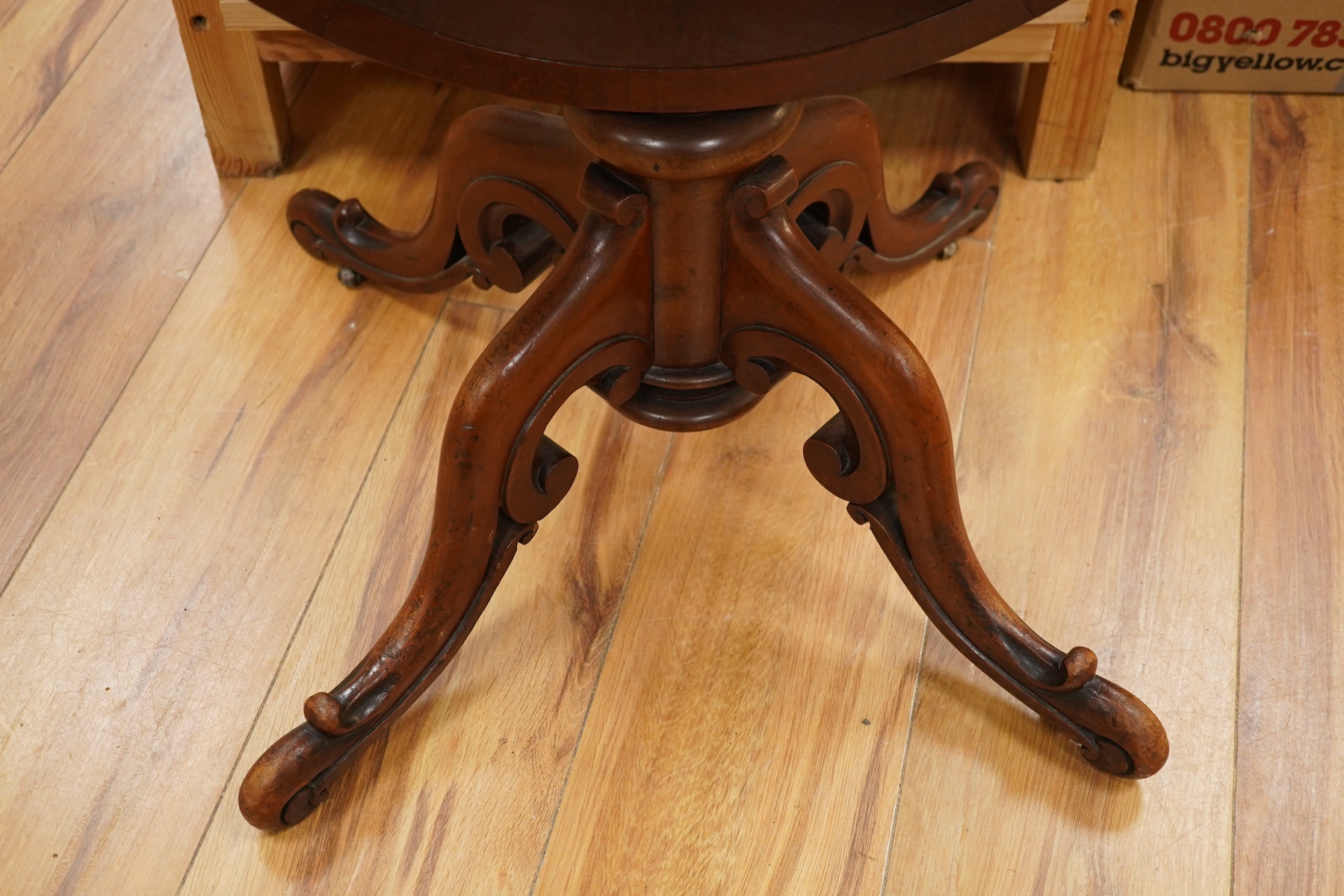 A mid 19th century mahogany pedestal Pembroke table, with inset brass plaque engraved; ‘Presented to Qtr. Master Sgt. Ed. Rainey by his Comrades the Officers, Non-Commissioned Officers and Privates of the 7th Company Lin